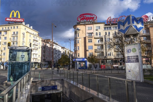 Sofia, Bulgaria. November 22nd 2025. Entrance to NDK metro at the at the junction of Vitosha Boularvard with brand signs for McDonalds, Happy and Coca-Cola, Sofia, Bulgaria