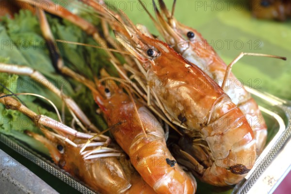 A tasty display of shrimp shellfish, a popular seafood menu snack sold from street food stalls and night markets in Bangkok, Thailand