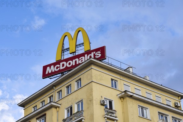 Sofia, Bulgaria. November 22nd 2025. World famous brand logo sign for McDonald's fast food chain being advertised on a rooftop in the city center of Sofia, Bulgaria