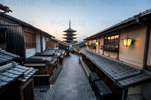 Yasaka dori historic street in the old town with traditional Japanese houses, five-story Yasaka Pagoda of the Buddhist Hokanji Temple at the back, evening mood, blue hour, Higashiyama, Kyoto, Japan