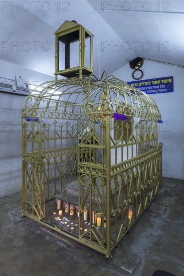 Tomb of Hasidic Rabbi Elimelech in a gilded grid at the Lezajsk Jewish Cemetery, Poland