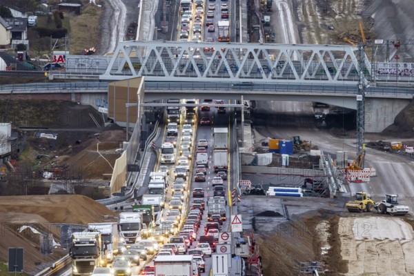 Traffic jam at the permanent construction site of the A8 motorway near Pforzheim-Ost. One side of the three-lane extension at the Enz Valley crossing is complete, the cars are driving on the new roadway. Construction has now begun in the direction of Karlsruhe. Niefern-Öschelbronn, Baden-Württemberg, Germany