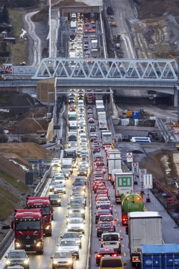 Traffic jam at the permanent construction site of the A8 motorway near Pforzheim-Ost. One side of the three-lane extension at the Enz Valley crossing is complete, the cars are driving on the new roadway. Construction has now begun in the direction of Karlsruhe. Niefern-Öschelbronn, Baden-Württemberg, Germany