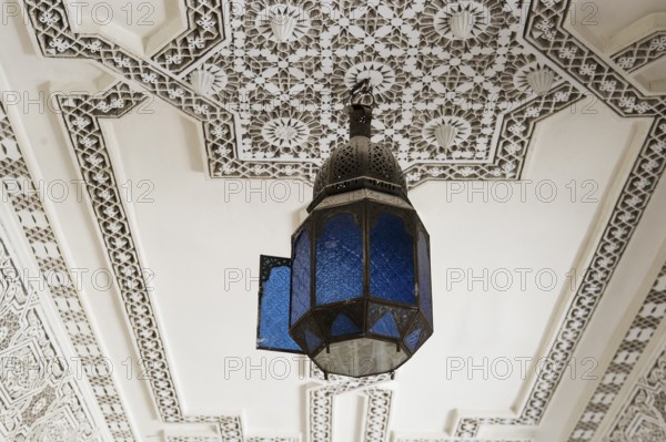 Lamp and stucco ceiling, Souk, Marrakech, Morocco