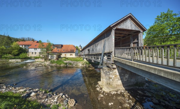 Covered wooden bridge from 1818 and historic water mill on the Ilm river, Buchfart, Weimarer Land, Thuringia, Germany