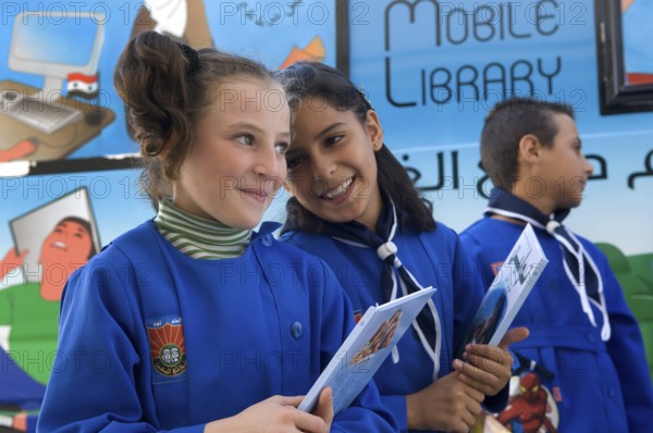 Latakia Countryside, Syria. October 18th 2010 Syrian schoolchildren collecting books from a mobile library in a remote village in the mountains above Latakia, Syria