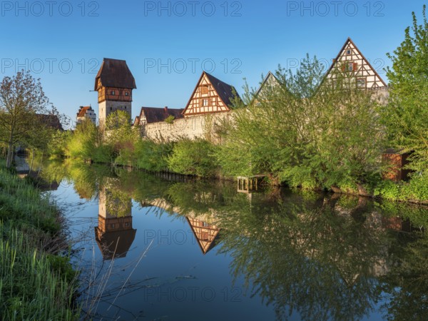View of the old town with half-timbered houses, towers and city wall, left the Bäuerlinsturm, reflection in the Wörnitz river, Romantic Road, Dinkelsbühl, Middle Franconia, Bavaria, Germany