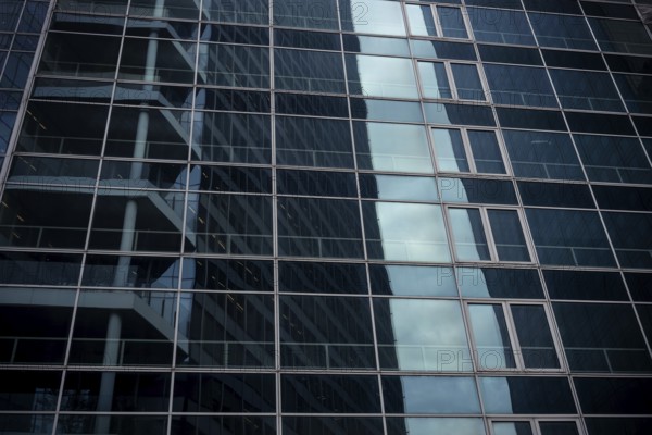 Abstract architecture of a glass fronted office building in a Paris commercial and financial centre, France