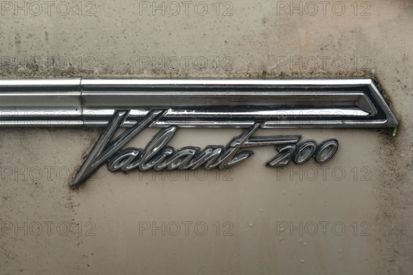 Rhine Falls, Switzerland. 26th September 2024 Badge of a Plymouth Valiant 200 four-door sedan car, an automobile manufactured by the Chrysler Company. A popular compact car parked outside a garage in Switzerland