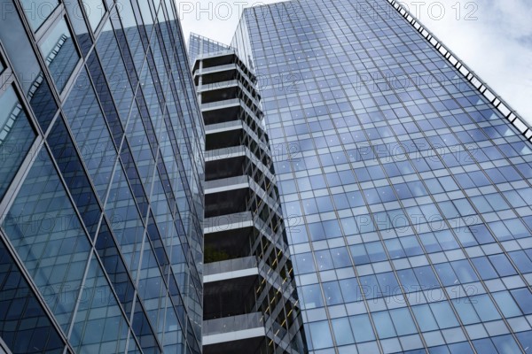 Abstract business architecture of a glass fronted office building in a Paris commercial and financial centre, France