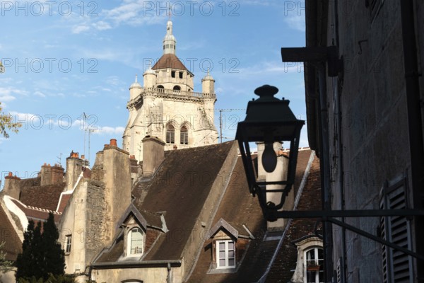 Roof tops and church view of the beautiful architecture of Dole in the Jura region of France beside the River Doubs and Rhine-Rhone canal, a historical city located southeast of Dijon, France