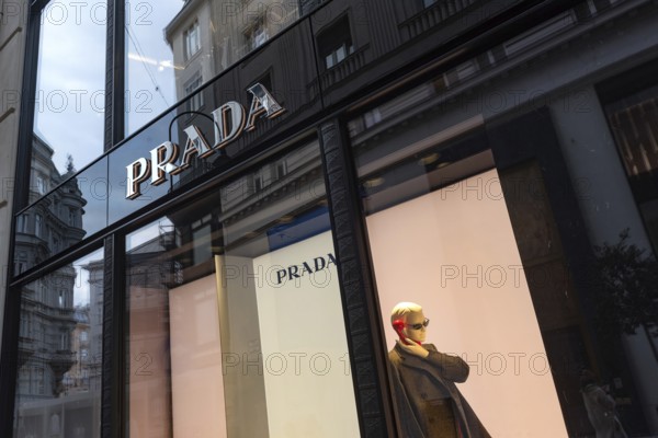 Vienna, Austria. October 15th 2024 Prada store front sign and mannequin display, a popular luxury brand in shopping district of central Vienna, Austria