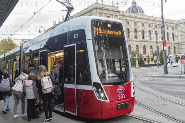 Vienna, Austria October 14th 2024 Passengers boarding 71 Tram the first district Innere Stadt, near Hofburg Palace and the Palace of Justice, central Vienna, Austria
