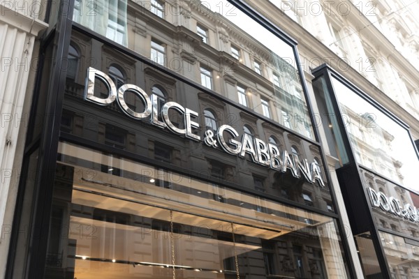 Vienna, Austria. October 15th 2024 Dolce and Gabba brand sign on a store front selling luxury fashion and cosmetic gifts in the central shopping district of Vienna, Austria