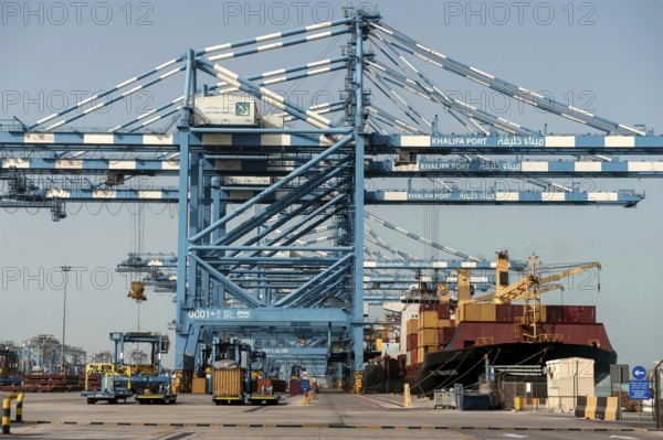 Abu Dhabi, United Arab Emirates. June 27th 2019. Shipping containers being loaded onto a ship at Khalifa Port, Abu Dhabi, United Arab Emirates, Middle East