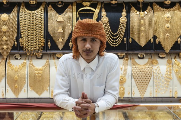 Dubai, United Arab Emirates. July 1st 2019 A young local man working in a jewellery shop in the popular Gold Souk, a busy market in the Creek Harbour district of Deira, Dubai, UAE