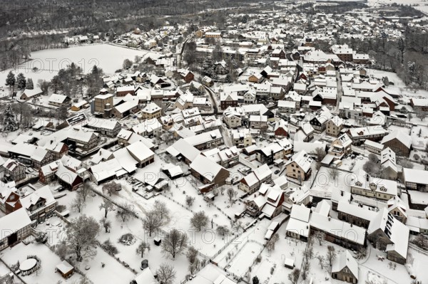 Winter aerial view of a snowy village with half-timbered houses, Herleshausen in northern Hesse