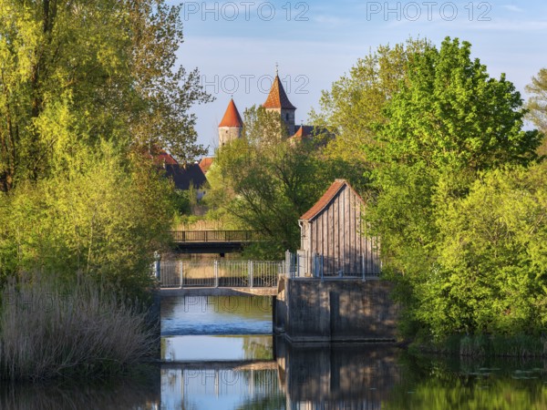 The river Altmühl in the Altmühl valley, behind the medieval towers of Ornbau, Middle Franconia, Bavaria, Germany