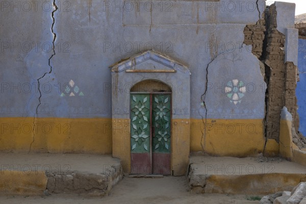 Aswan, Egypt. December 10th 2022 Traditional brightly coloured painted Nubian house in a village on the west bank of the River Nile near Aswan in Upper Egypt