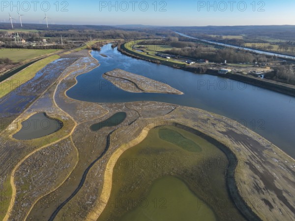 Haltern-Marl, North Rhine-Westphalia, Germany - Lippe, flood protection in the Haltern-Lippramsdorf-Marl area (HaLiMa) . Flood protection on the River Lippe by relocating the dyke and thus extending the floodplain. On the left, the completed floodplain north, the north dyke. Work is still in progress on the south dyke. At the back left, the headframe of the former shaft 8 of Auguste Victoria colliery