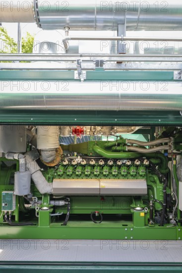 Dinslaken, North Rhine-Westphalia, Germany - Combined heat and power plants (CHP) generate electricity from wastewater digester gases, which is used by the Emscher-Mündung sewage treatment plant for its own power supply. The old CHP unit at the Emscher-Mündung sewage treatment plant in Dinslaken is getting on in years and needs to be replaced. Temporary rental CHP units (pictured here) relieve the stationary CHP units so that they can then be renewed or replaced