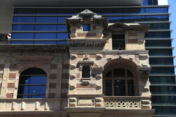 Romania, capital Bucharest, Bucuresti, House of the Union of Romanian Architects, The building is known for its distinctive architectural combination of old and new, with a modern glass tower rising from the ruins of a historic house, the original Paucescu House building was built around 1880 in the French Renaissance style and was severely damaged during the Romanian Revolution of 1989