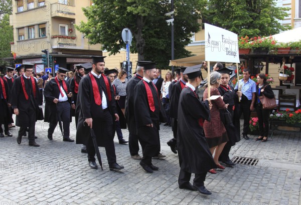 Romania, students from the Faculty of Sciences at a graduation parade in the old town of Sibiu, Sibiu, Transylvania