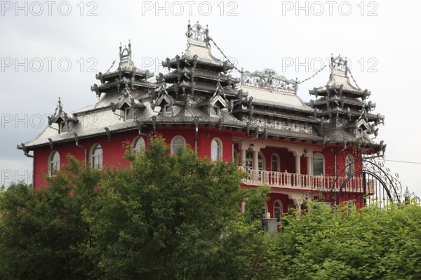 Romania, house of a gypsy baron with richly decorated roof, Hunedora County, Transylvania, Romania