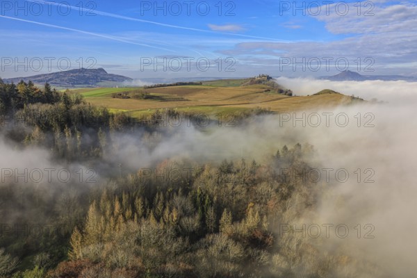 Foggy landscape in Hegau with hills and forests under a clear blue sky, Hohenkrähen castle ruins, volcanic landscape, Hegau, Mühlhausen-Ehingen, Singen, Konstanz district, Baden-Württemberg, Germany