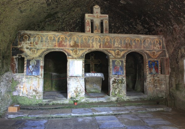 Corbii de Piatra rock monastery, stone ravens carved into a massive, 30-meter high sandstone wall, village of Jgheaburi, municipality of Corbi, in the district of Argesin, Wallachia, Romania