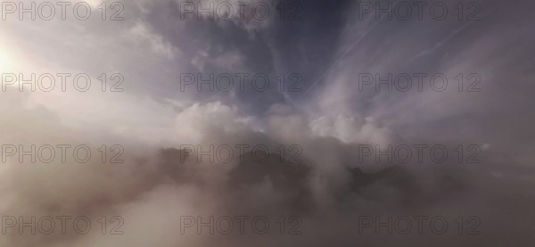 Gentle fog and cloud formations over a mountain landscape at dusk, hiking in the High Tatras National Park, Carpathian Mountains, Poland