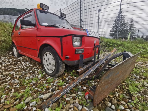 Mini car Fiat 126 Maluch as a snow plough, Zakopane, hiking to Kasprowy Wierch in the High Tatras National Park, Carpathian Mountains, Poland
