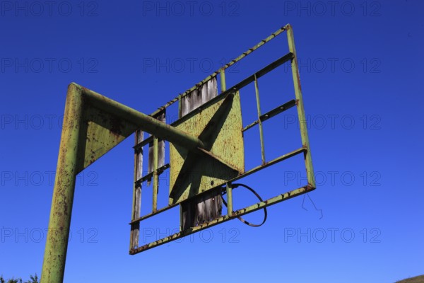 Rusty frame of an old basketball hoop, metal frame, basketball, rusted