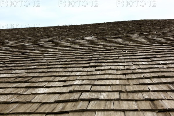 Close-up of a traditional wooden shingle roof, building materials, wood shingles