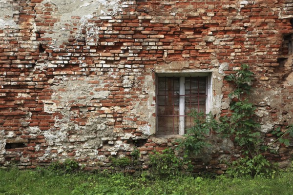Dilapidated house wall with window, built with brick, Transylvania, Romania