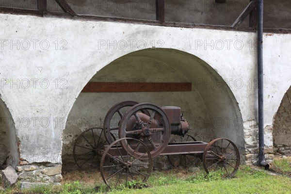 Old agricultural equipment within the defensive wall of the fortified church of Valea Viilo, German wormhole, a community in Sibiu district in Transylvania, UNESCO World Heritage Site, Romania