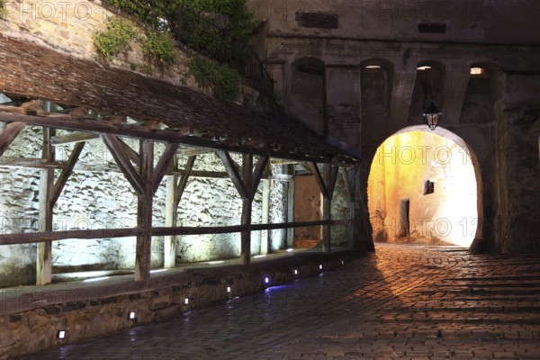 Romania, the way through the hour tower at blue hour in the historic old town of Sighisoara, German Sighisoara, town in Mures district in Transylvania, UNESCO World Heritage Site