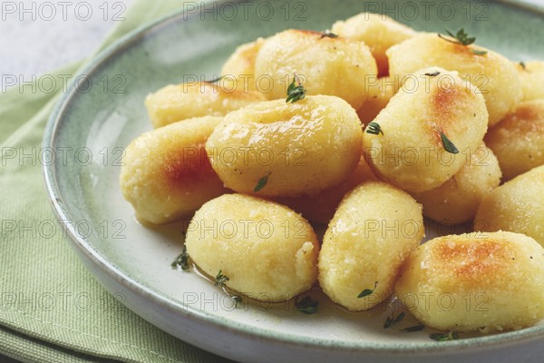 Stuffed gnocchi with cheese, Italian dumplings, garnished with parmesan cheese, no people