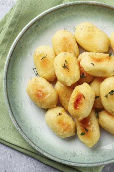 Stuffed gnocchi with cheese, Italian dumplings, garnished with parmesan cheese, no people