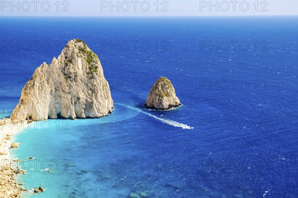 The Mizithres are two spectacular rock formations rising majestically from the azure Ionian Sea off the western coast of Zakynthos. Located near the picturesque village of Keri