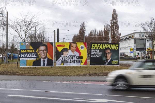 Election advertising for the 2026 state election in Baden-Württemberg. Large posters of the Green Party, CDU and FDP. Top candidates Manuel Hagel and Cem Özdemir. Fellbach, Baden-Württemberg, Germany