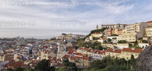 Panoramic view of Lisbon, a city with red roofs and buildings on a hill, Lisbon, Portugal