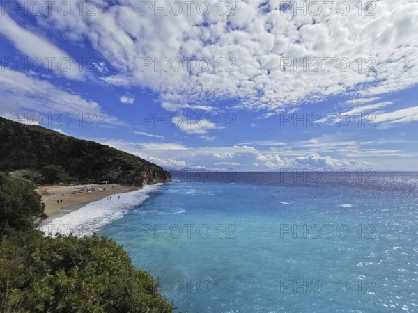 Panoramic view of a beach with turquoise sea and spectacular cloud patterns, Gjipe Beach, Albania
