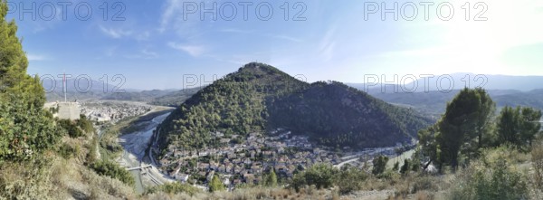 Panoramic view of Berat, of wooded hills, valley with river under clear sky, Berat, Albania