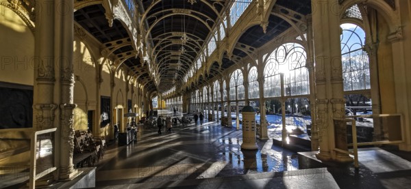 Large, sun-drenched interior of a historic hall with arched windows and columns, wellness, Marienbad, Czech Republic
