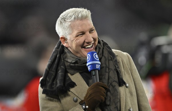 TV expert Bastian Schweinsteiger, portrait, smiles, in interview microphone Mikro Logo ARD BR Bayerischer Rundfunk, soccer Bundesliga, DFB-Pokal, Allianz Arena, Munich, Bayern, Germany
