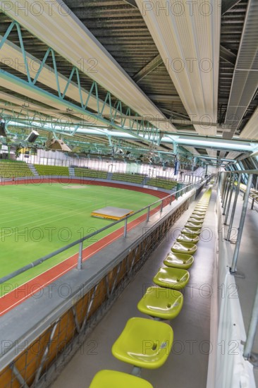 Elevated stand with green seats and view of a sports hall, Sindelfingen Glass Palace, Böblingen district, Germany