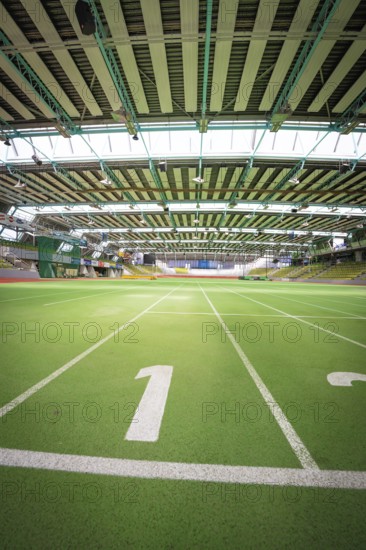Interior view of a large sports hall with green running track and stands, Sindelfingen Glass Palace, Böblingen district, Germany