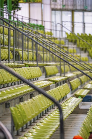 Detailed view of green seats and railings of a sports hall gallery, Sindelfingen Glass Palace, Böblingen district, Germany
