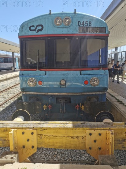 Front view of a blue train in daylight at a train station, Lagos, Algarve, Portugal